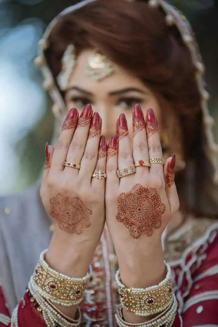Finger and back hand flower mehndi
