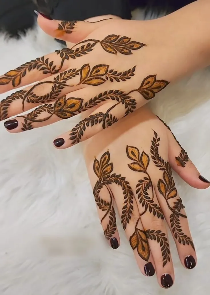 “modern bridal khafif mehndi back hand design