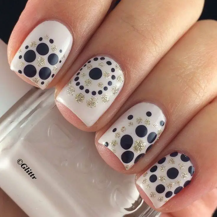 white nails with black polka dots