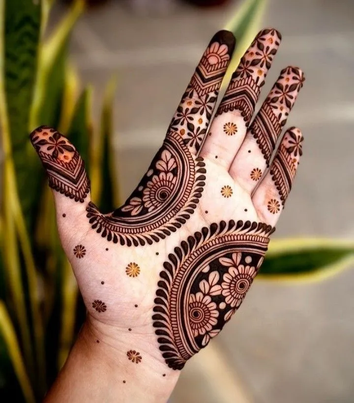 Floral royal mehndi design for front hands