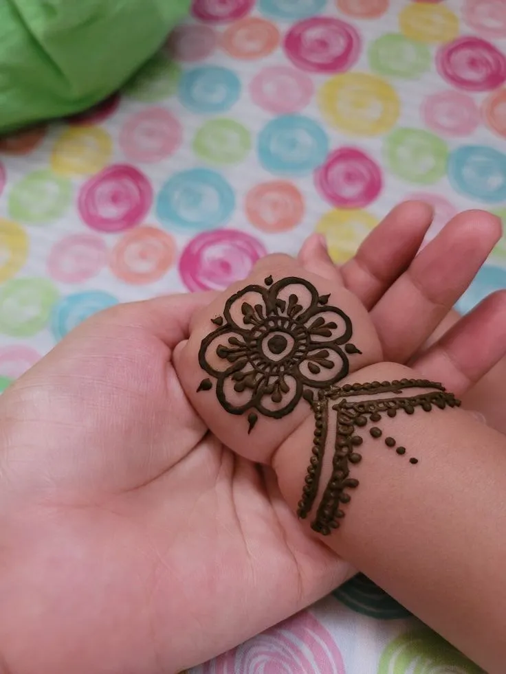 Kids' hand with simple mehndi design