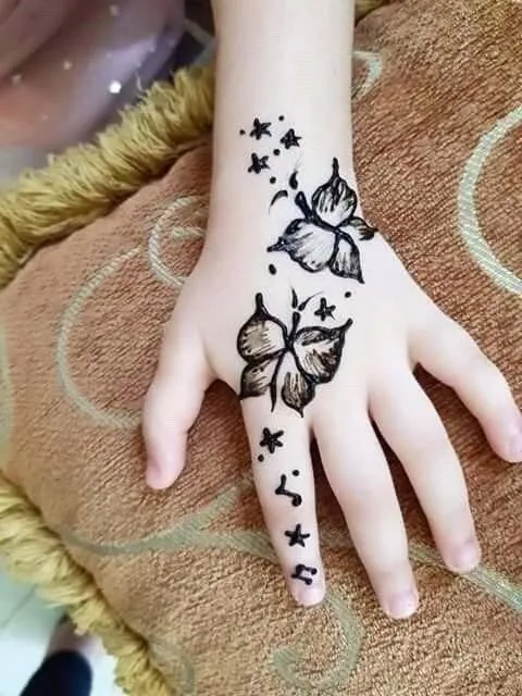 Kids mehndi art with butterfly and dots