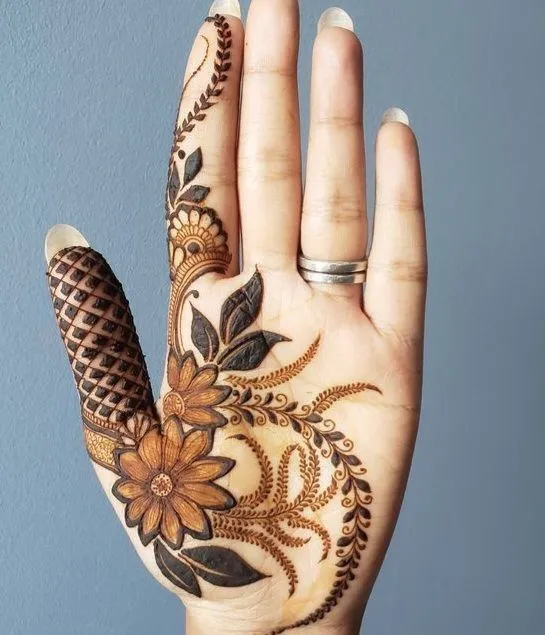 Royal front hand mehndi design with delicate floral patterns