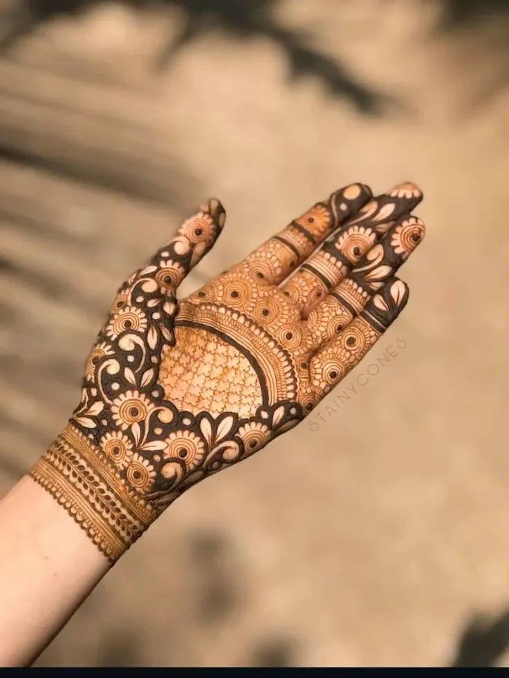 Royal front hand mehndi with geometric patterns