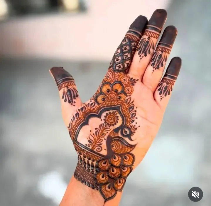 Royal front hand mehndi with peacock feather