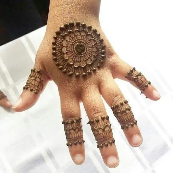 Tiny mehndi motifs on fingers