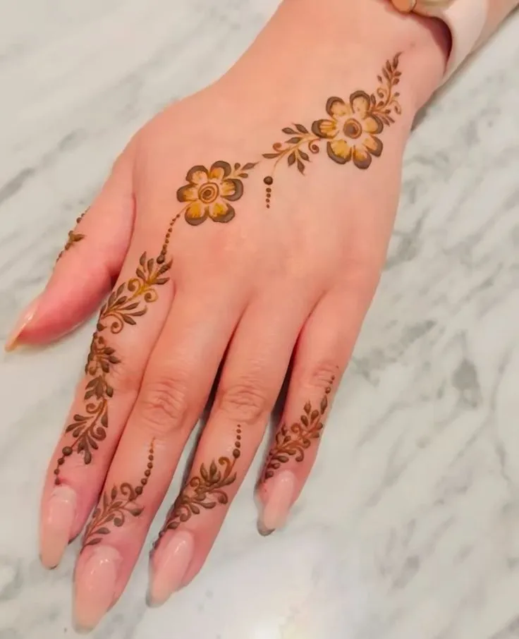 back hand rose henna art