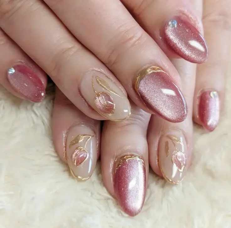 Golden glitter and pinkish nail extensions